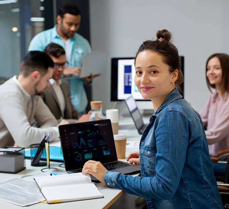 GSR consultants collaborating around a laptop