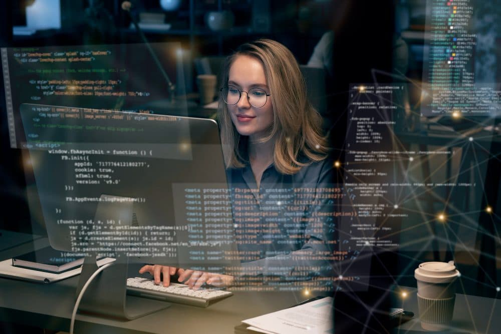 Developer working with code on screen