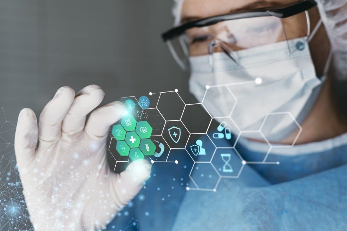 Doctor in goggles interacting with digital health icons