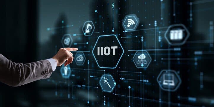 Hand touching an IIoT network diagram