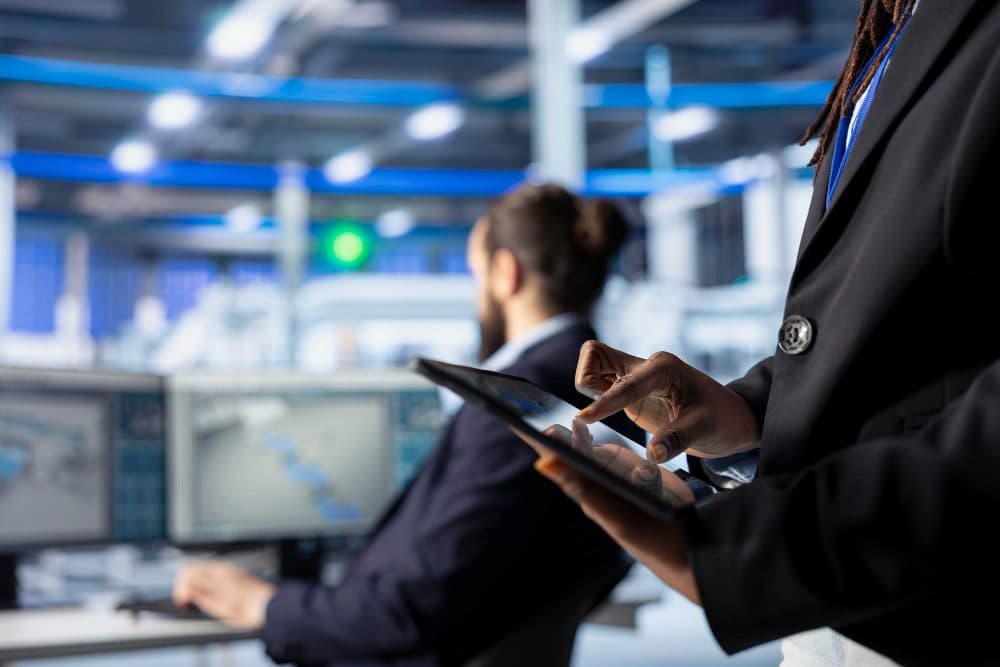 Consultant reviewing systems on a tablet